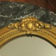 miroir ovale moulure sculptée dorée